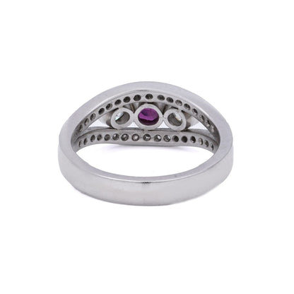 Platinum three stone diamond and ruby ring.