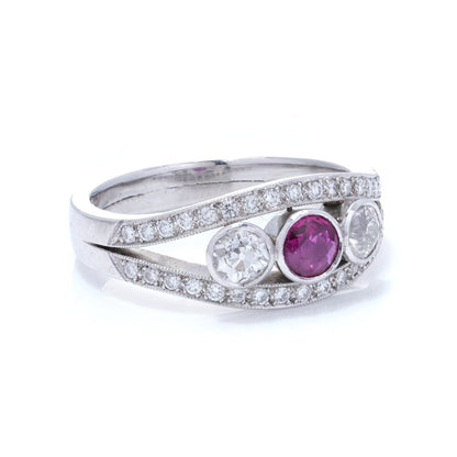 Platinum three stone diamond and ruby ring.