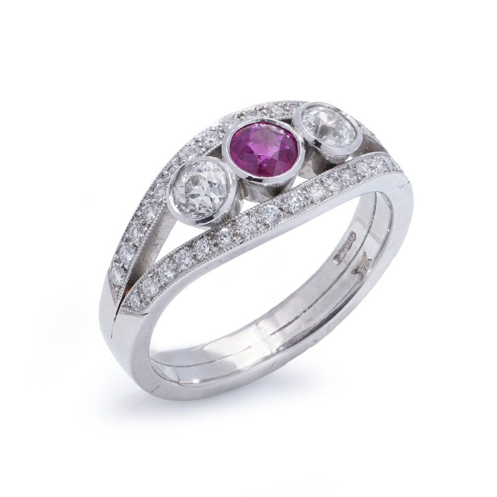 Platinum three stone diamond and ruby ring.