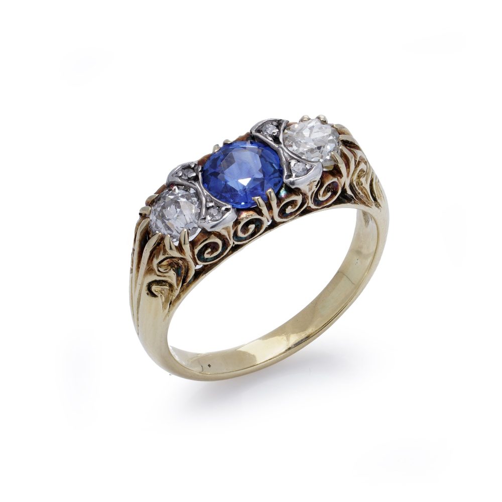 Antique sapphire and diamond three stone ring in gold and silver.