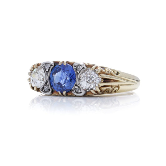 Antique sapphire and diamond three stone ring in gold and silver.