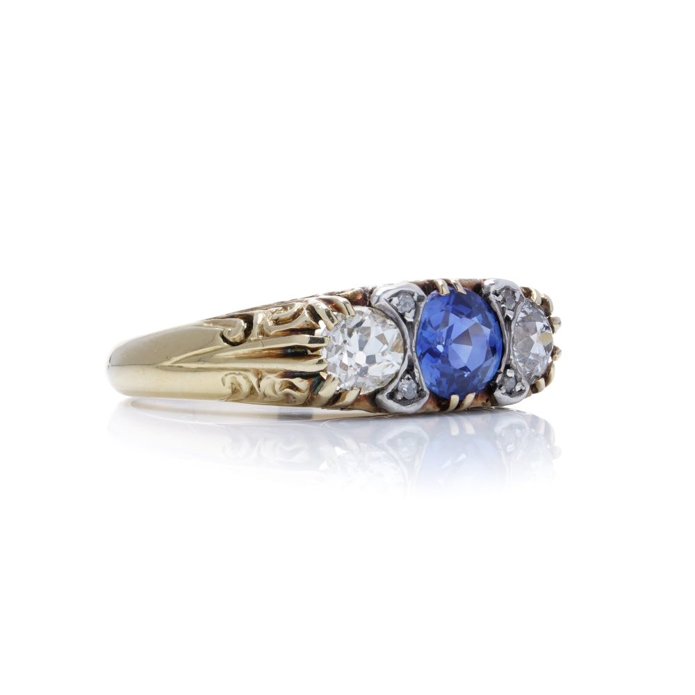 Antique sapphire and diamond three stone ring in gold and silver.