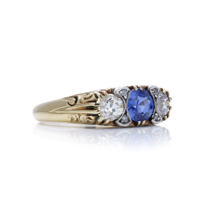 Antique sapphire and diamond three stone ring in gold and silver.