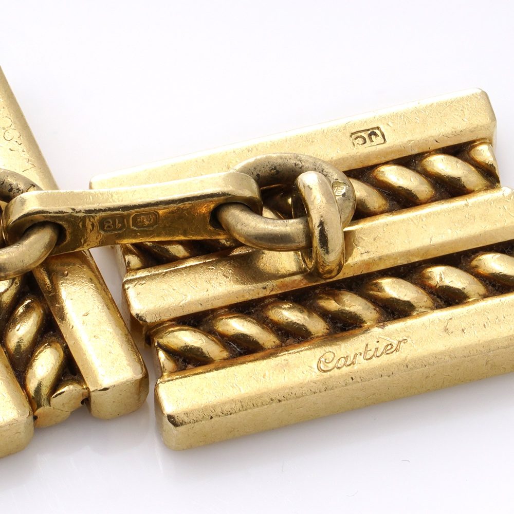 Vintage Cartier 18ct Yellow Gold Geometric Pattern Cufflinks, with clean lines and geometric shapes in a rope-like pattern. Circa 1970s - 1980s