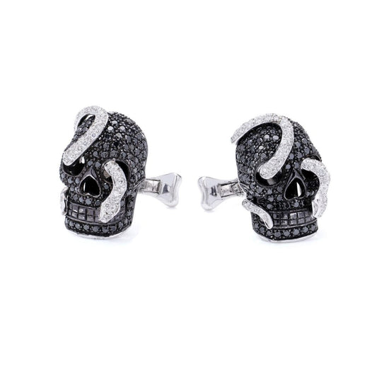 Theo Fennell gold cufflinks with black and white diamonds.