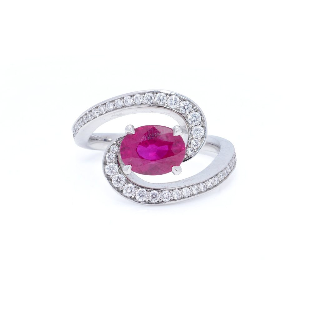Vintage 1.20ct Ruby and Diamond Dress Ring, central 1.20ct oval red ruby surrounded by dynamic curve with pavé-set diamonds in platinum. Circa 1990s