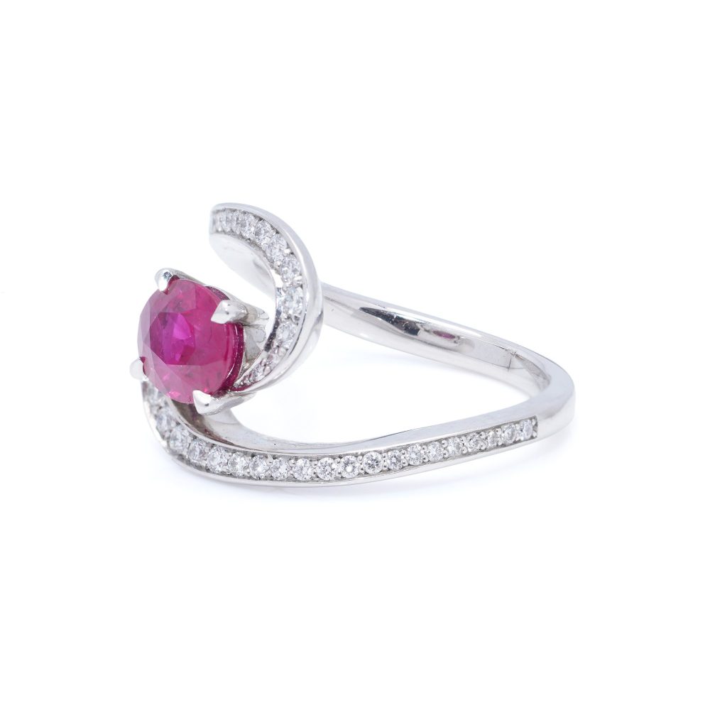 Vintage 1.20ct Ruby and Diamond Dress Ring, central 1.20ct oval red ruby surrounded by dynamic curve with pavé-set diamonds in platinum. Circa 1990s