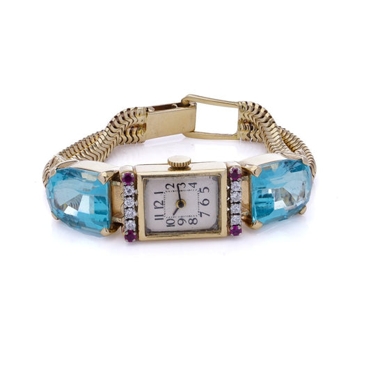 Ladies gold cocktail watch with Gemstones.