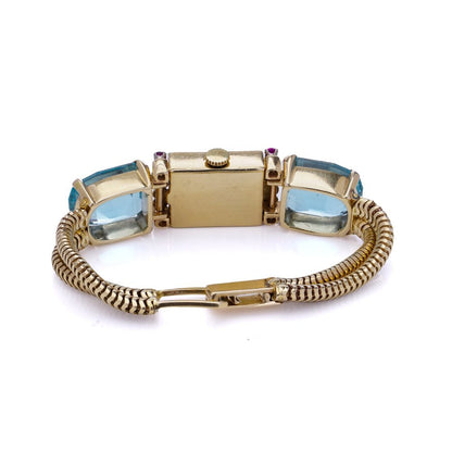 Ladies gold cocktail watch with Gemstones.