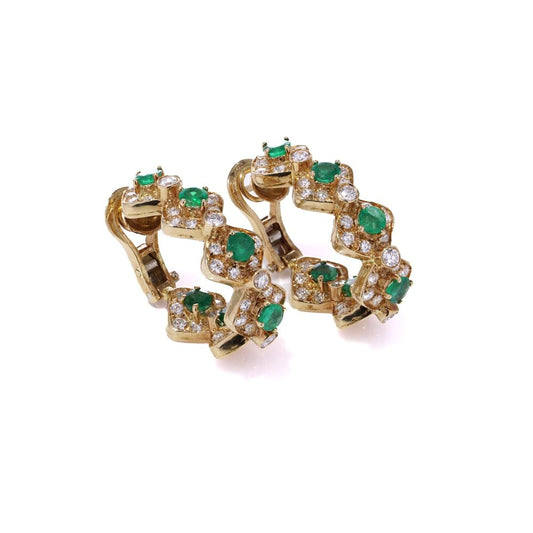 Emerald and diamond earrings in yellow gold.