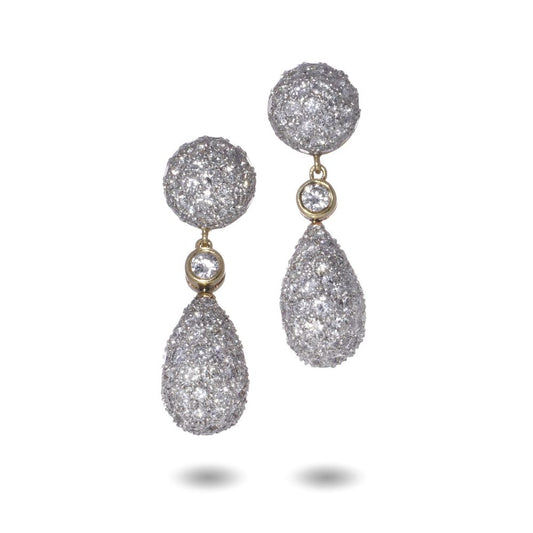 Diamond drop earrings in yellow and white gold.