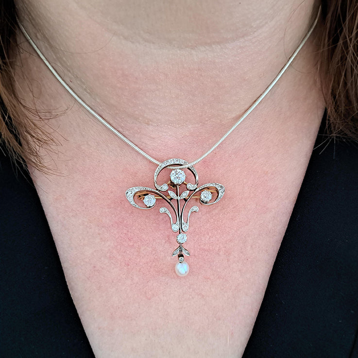 Antique Art Nouveau 1.60ct Old Cut Diamond and Pearl Pendant come Brooch in platinum upon yellow gold. Circa 1870
