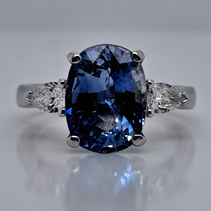 4.80ct Oval Sri Lanka Sapphire and Pear Cut Diamond Trilogy Three Stone Engagement Ring in platinum