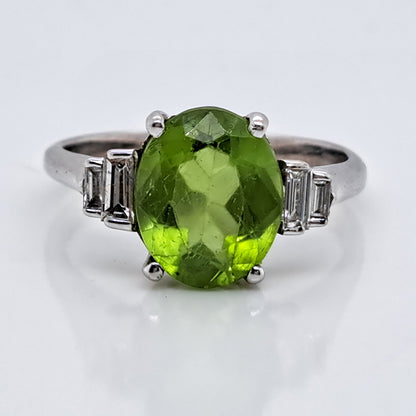 Oval Peridot and Baguette Diamond Engagement Ring in 18ct White Gold