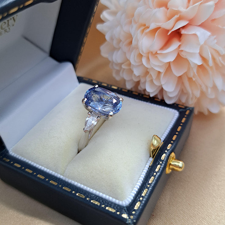 4.80ct Oval Sri Lanka Sapphire and Pear Cut Diamond Trilogy Three Stone Engagement Ring in platinum