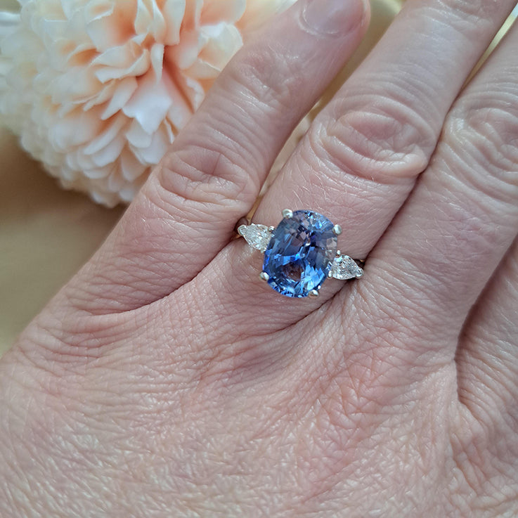 4.80ct Oval Sri Lanka Sapphire and Pear Cut Diamond Trilogy Three Stone Engagement Ring in platinum