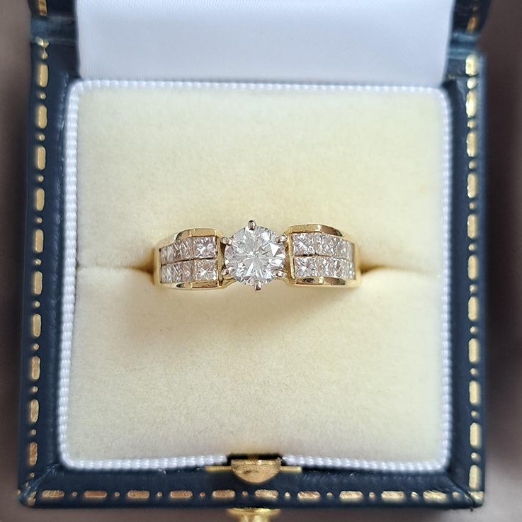 Vintage 0.65ct Diamond Solitaire Engagement Ring with Princess Diamond Shoulders