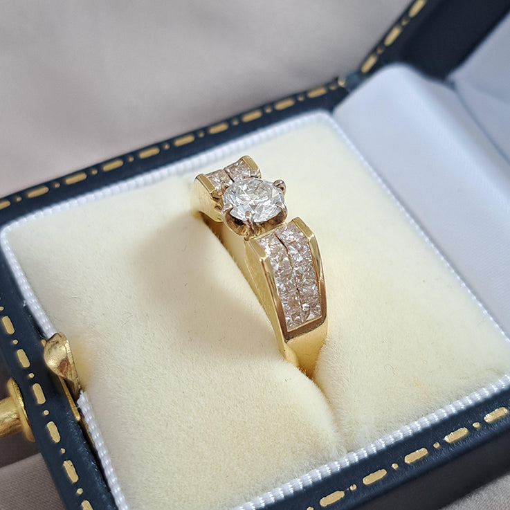 Vintage 0.65ct Diamond Solitaire Engagement Ring with Princess Diamond Shoulders