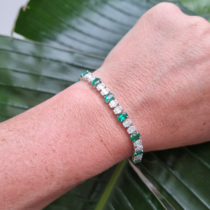 Oval Cut 6.72ct Emerald and Diamond Line Tennis Bracelet in 18ct White Gold