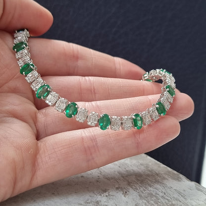 Oval Cut 6.72ct Emerald and Diamond Line Tennis Bracelet in 18ct White Gold