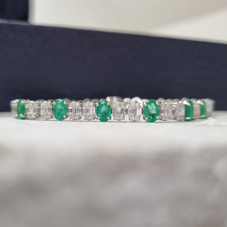 Oval Cut 6.72ct Emerald and Diamond Line Tennis Bracelet in 18ct White Gold