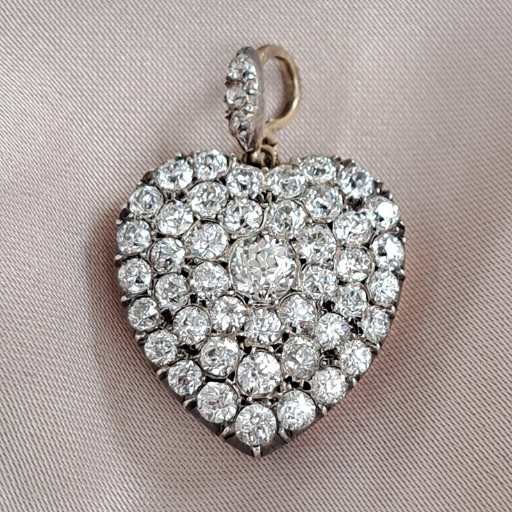 Antique 4.25ct Old Mine Cut Diamond Heart Pendant,4.25 carats of old mine-cut diamonds in silver upon gold with Rock crystal locket compartment to reverse