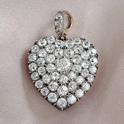 Antique 4.25ct Old Mine Cut Diamond Heart Pendant,4.25 carats of old mine-cut diamonds in silver upon gold with Rock crystal locket compartment to reverse