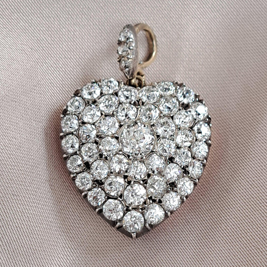 Antique 4.25ct Old Mine Cut Diamond Heart Pendant,4.25 carats of old mine-cut diamonds in silver upon gold with Rock crystal locket compartment to reverse