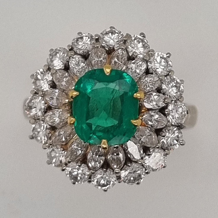 Vintage Muzo Italian 1.4ct Emerald and 2.5ct Diamond Double Cluster Ring, cushion-shaped emerald surrounded by marquise-cut and brilliant-cut diamonds 18ct white gold. Circa 1970s