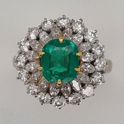 Vintage Muzo Italian 1.4ct Emerald and 2.5ct Diamond Double Cluster Ring, cushion-shaped emerald surrounded by marquise-cut and brilliant-cut diamonds 18ct white gold. Circa 1970s