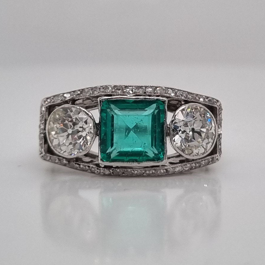 Edwardian Antique 1.40ct Emerald and 1.30ct Old Cut Diamond Three Stone Engagement Ring in Platinum