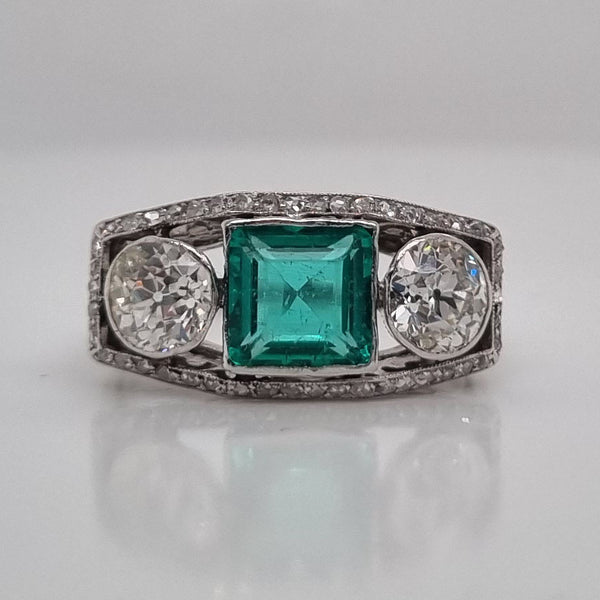Edwardian Antique 1.40ct Emerald and 1.30ct Old Cut Diamond Three Stone Engagement Ring in Platinum