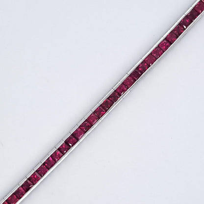 Square Cut Ruby Line Tennis Bracelet, 6.56 carat of square-cut rubies channel set in 18ct white gold