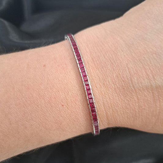 Channel Set Square Cut Ruby Line Tennis Bracelet in 18ct White Gold, 6.56 carat total