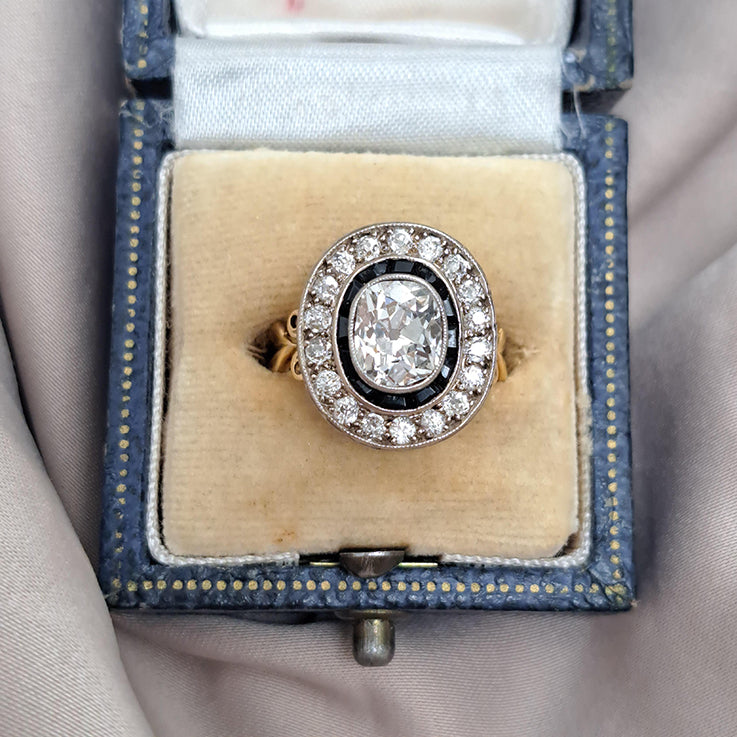 1.50ct Oval Old Mine Cut Diamond and Onyx Cluster Engagement Ring in 18ct yellow gold