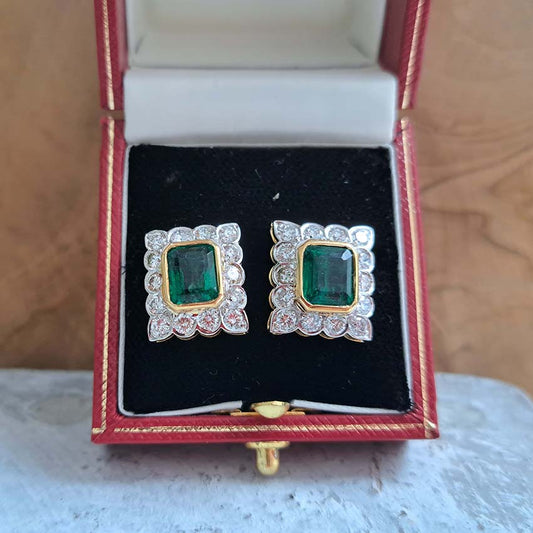 A pair of emerald and diamond rectangular cluster earrings in yellow and white gold, in a vintage earring box