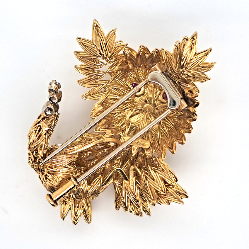 Cartier Vintage 18ct Gold Dog Brooch with Diamond and Ruby, ruby eyes and diamond accents to the tail. Circa 1960s. Signed Cartier and Numbered 019177