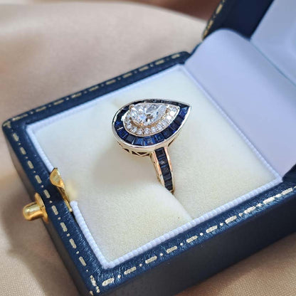 1ct Pear Cut Diamond and Sapphire Target Cluster Engagement Ring