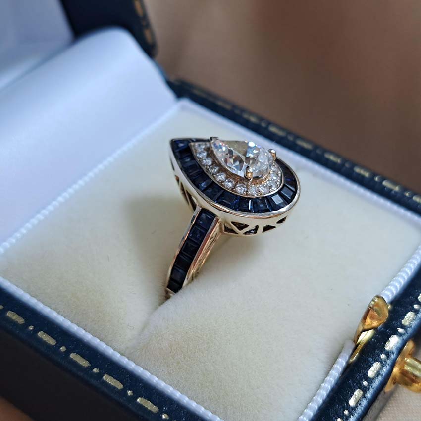1ct Pear Cut Diamond and Sapphire Target Cluster Engagement Ring