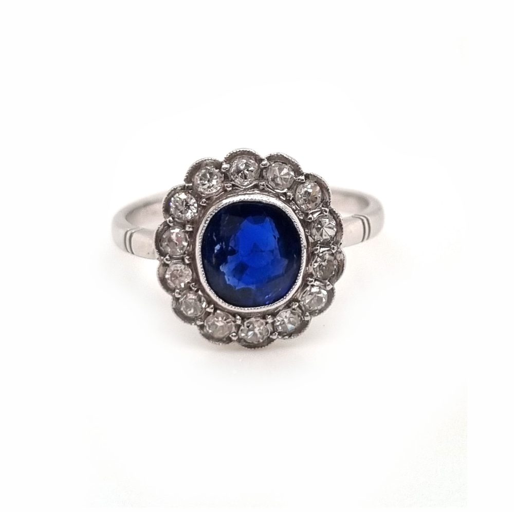 Vintage sapphire and diamond cluster engagement ring in 18ct white gold