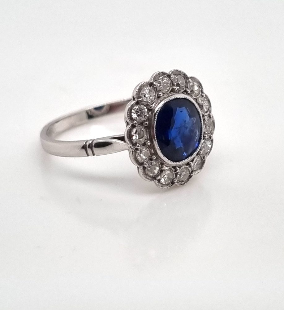 Vintage sapphire and diamond cluster engagement ring in 18ct white gold