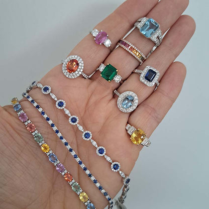 13.44ct Oval Fancy Rainbow Sapphire and Diamond Line Bracelet in 18ct White Gold with orange, yellow, green, pink/purple, and blue sapphires