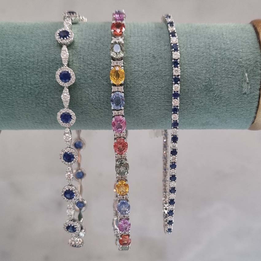 2.36 Sapphire and Diamond Cluster Line Tennis Bracelet, sapphire and diamond clusters connected via marquise/navette shaped links set with sparkling diamonds in 18ct white gold