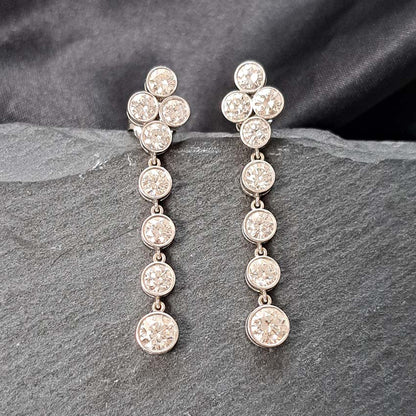 Quatrefoil 3.60ct Diamond Drop Earrings, quatrefoil tops suspend four gently graduating diamonds all bezel set in 18ct white gold