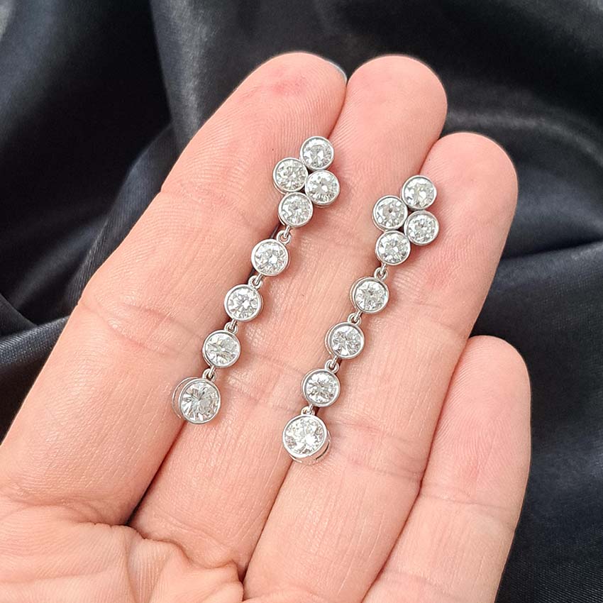 Quatrefoil 3.60ct Diamond Drop Earrings, quatrefoil tops suspend four gently graduating diamonds all bezel set in 18ct white gold