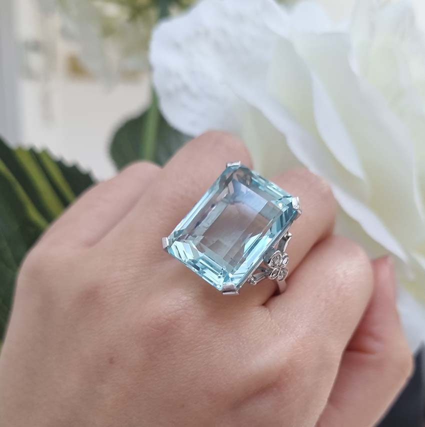 30ct Emerald Cut Aquamarine Cocktail Ring with Diamonds, large 30ct emerald-shaped step-cut aquamarine accented with sparkling diamonds to the shoulders in 18ct white gold