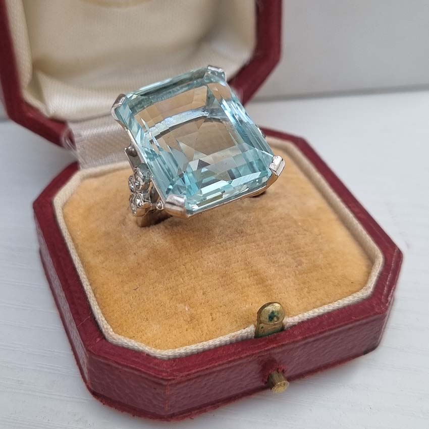 30ct Emerald Cut Aquamarine Cocktail Ring with Diamonds, large 30ct emerald-shaped step-cut aquamarine accented with sparkling diamonds to the shoulders in 18ct white gold