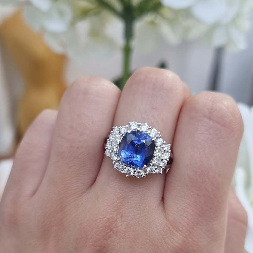 Oval Cushion Shaped Sapphire and Diamond Cluster Engagement Ring in 18ct white gold with split shoulders