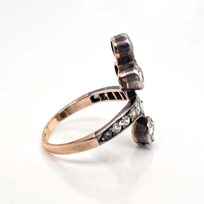 Antique Belle Epoque 1.35ct Rose Cut Diamond Ring, fleur-de-lis triple rose-cut diamond top and single rose-cut diamond solitaire bottom connected via diamond shoulders in silver upon yellow gold