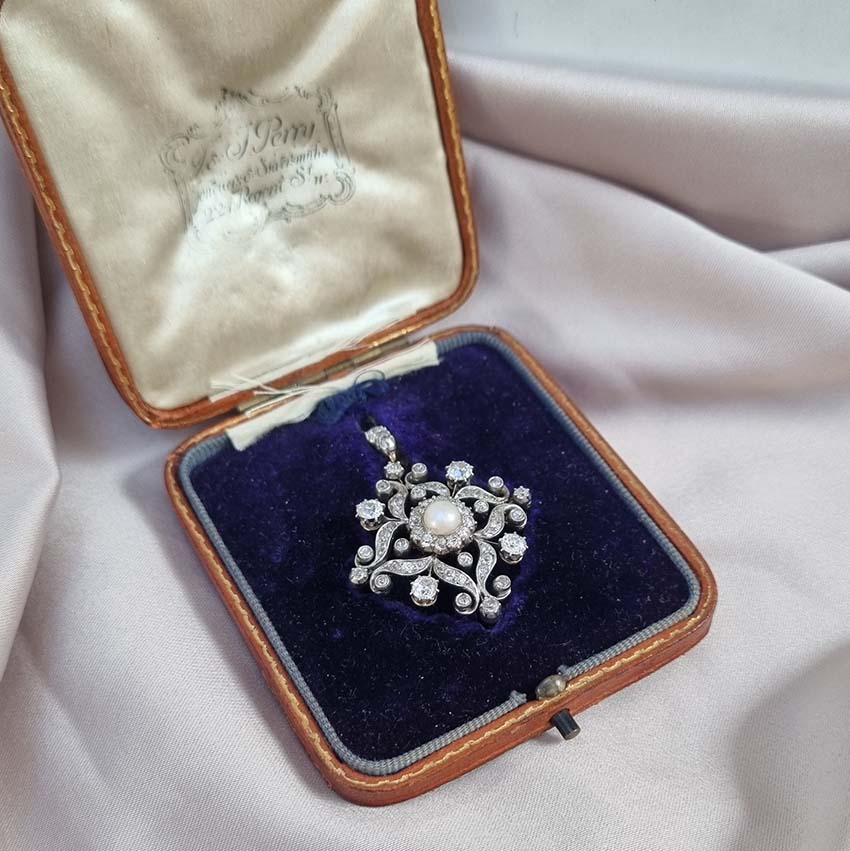 Victorian Antique Natural Pearl and Diamond Pendant come Brooch, central natural pearl surrounded by sparkling diamond in floral cluster design Presented in antique fitted box.